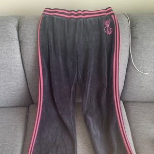 Selling black velvet tracksuit pants from early 2000s, flare stretchy pant legs.